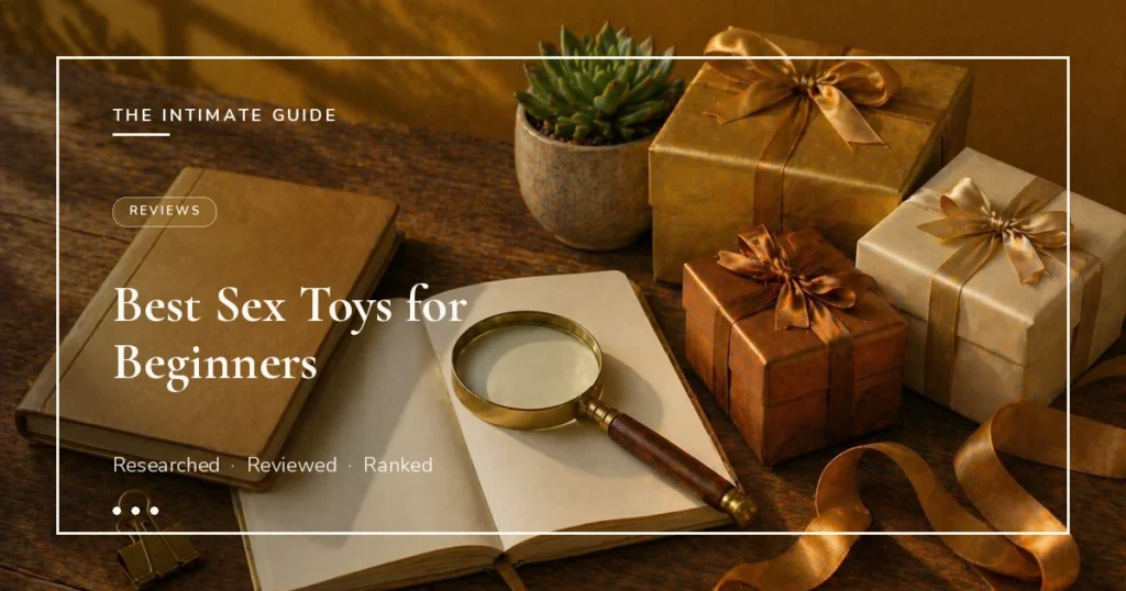 Open journal with magnifying glass, leather book, succulent, and wrapped gifts on amber wall — best sex toys for beginners.